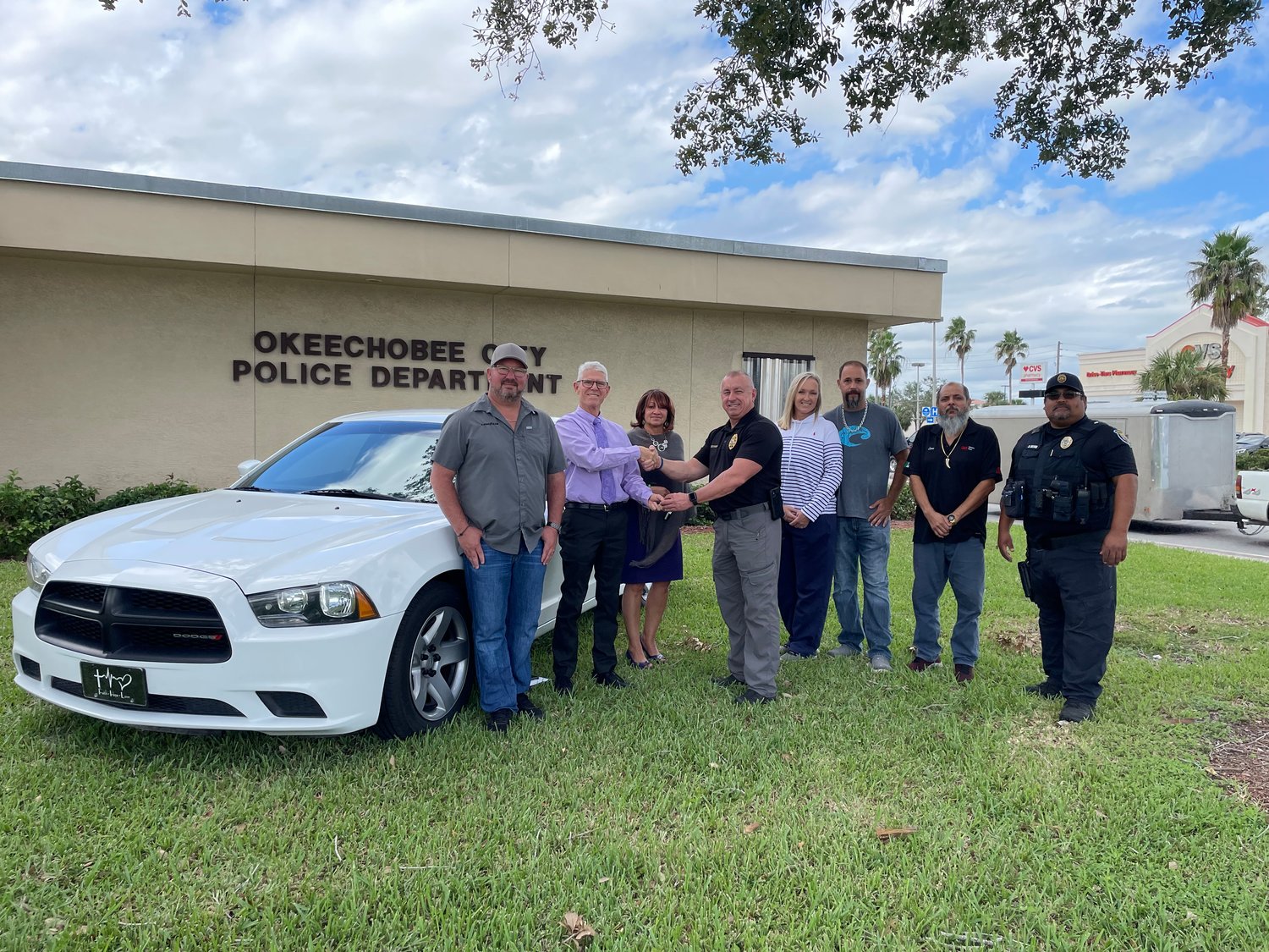 Okeechobee City Police Department donated a surplus patrol car to Martha's House this week. Pictured are (L to R) David McCormick (Tire Zone), Jonathan Bean (Martha's House), Edna Malagon (Martha's House), Chief Donald Hagan, Shayne Clayville and Hank Soler (Soler Automotive), Jose Luna (Luna Window tint and Lt. Belen Reyna.